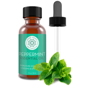 A 30 ml bottle of Peppermint Essential Oil, 100% Pure and Undiluted, with a label indicating it's 100% pure essential oil. The bottle is accompanied by a dropper and fresh peppermint leaves, showcasing its fresh, minty essence. The label also mentions "Cooling & Energizing.