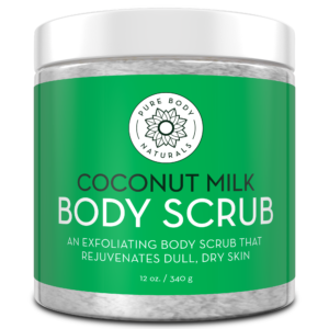 A jar of Coconut Milk Exfoliating Body Scrub with a green label. The text on the label reads "Coconut Milk Body Scrub" and "An exfoliating body scrub that rejuvenates dull, dry skin." The jar size indicated is 12 oz / 340g.