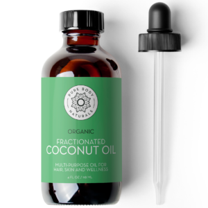 A brown glass bottle labeled "Fractionated Coconut Oil, 100% Pure" is shown next to a black-tipped dropper. The label is green with white text, indicating it is a multi-purpose oil for hair, skin, and wellness. The bottle contains 4 fl oz (118 mL).