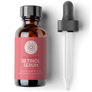 A brown glass bottle labeled "Retinol Face Serum with Witch Hazel, Myrtle Oil, and Ginseng, 1 Fl Oz" sits next to a dropper. The label includes text that reads "Reduces signs of aging and supports flawless skin." The bottle contains 1 fl. oz (30 mL) of serum and features a minimalist design.