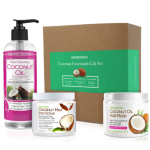The image shows a "Coconut Essentials Relaxation Gift Set" from Pure Body Naturals. It includes a fractionated coconut oil pump bottle, a jar of coconut milk body scrub, and a container of coconut oil hair mask, all displayed in front of the gift set box.