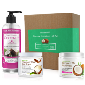 The image shows a "Coconut Essentials Relaxation Gift Set" from Pure Body Naturals. It includes a fractionated coconut oil pump bottle, a jar of coconut milk body scrub, and a container of coconut oil hair mask, all displayed in front of the gift set box.