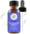 A brown glass bottle labeled "Vitamin B3 Serum" with a black dropper cap next to it. The label indicates the serum hydrates, repairs, and protects skin. The background features splashes of a liquid substance.