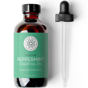 An amber glass bottle labeled "Peppermint Essential Oil, 4 fl oz" with a green label, accompanied by a black dropper. The text on the bottle also reads "Cooling & Energizing" and "4 fl oz / 120 ml.