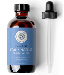 A brown glass bottle labeled "Frankincense Essential Oil, 4 fl oz" from Pure Body Naturals, meant for yoga, meditation, and relaxation. The bottle has a blue label and comes with a black dropper beside it. The bottle holds 4 fl oz (120 ml) of essential oil.